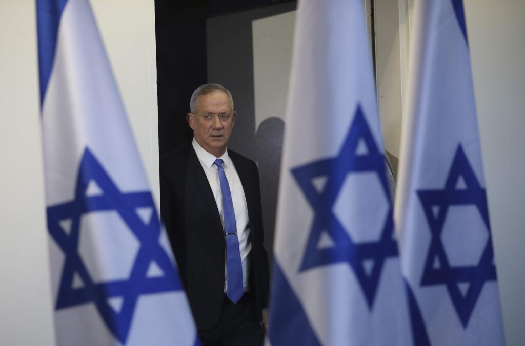 Blue and White party leader Benny Gantz arrives to address media in Tel Aviv,Israel. Wednesday, Nov. 20, 2019. Gantz has failed to form a new government by a deadline, dashing his hopes of toppling the long-time Israeli prime minister Netanyahu and pushing the country closer toward an unprecedented third election in less than a year. (AP Photo/Oded Balilty)