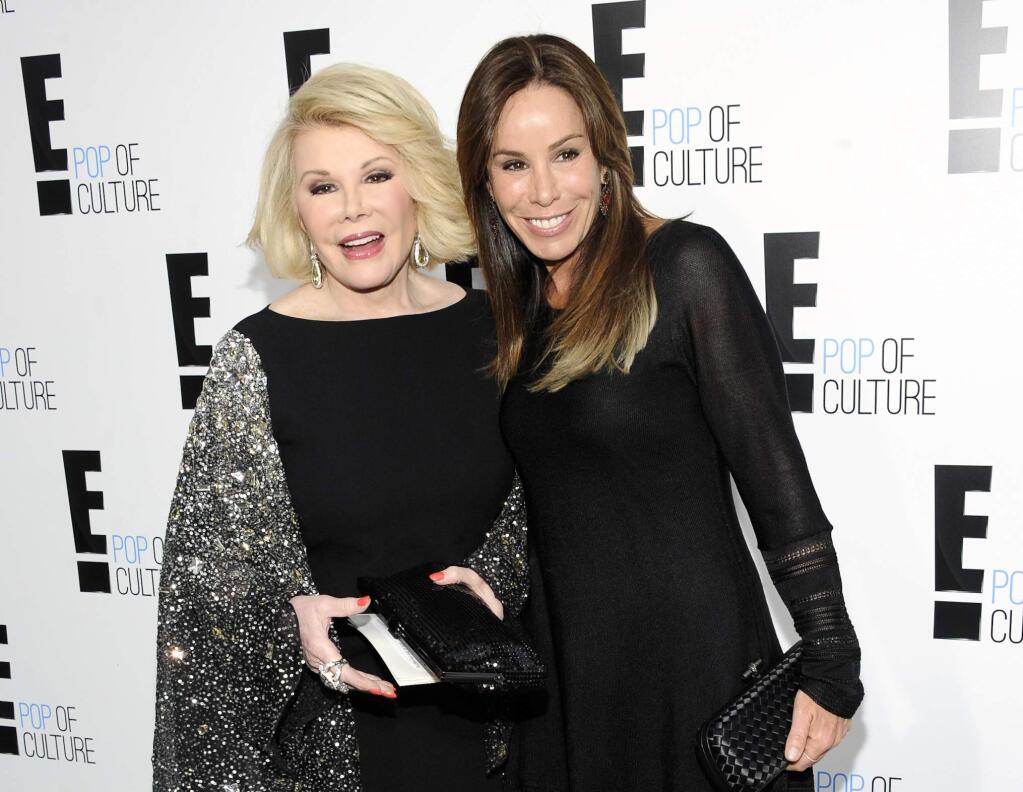 FILE - This April 30, 2012 file photo shows comedian and TV host Joan Rivers from the show 'Fashion Police' and her producer daughter Melissa Rivers at an E! Network upfront event in New York. Comedian Kathy Griffin replaced the late Joan Rivers on the fashion series and announced her departure on Thursday, March 12, 2015. (AP Photo/Evan Agostini, file)