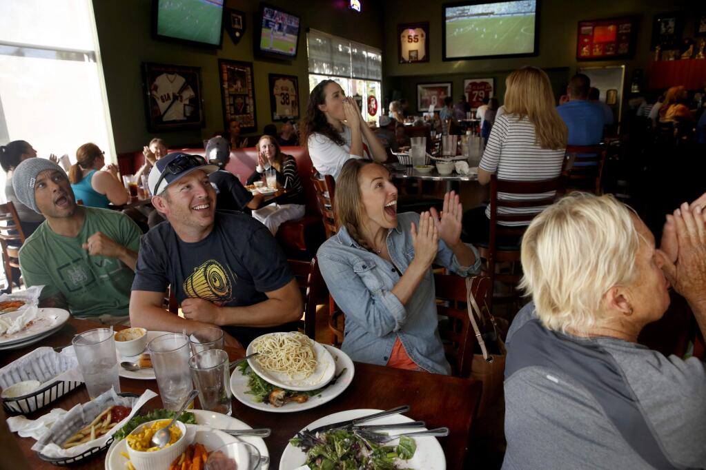 Soccer fans react as the USA plays Japan during the World Cup final at Beyond The Glory Sports Bar and Grill on Sunday, July 5, 2015 in Petaluma, California . (BETH SCHLANKER/ The Press Democrat)