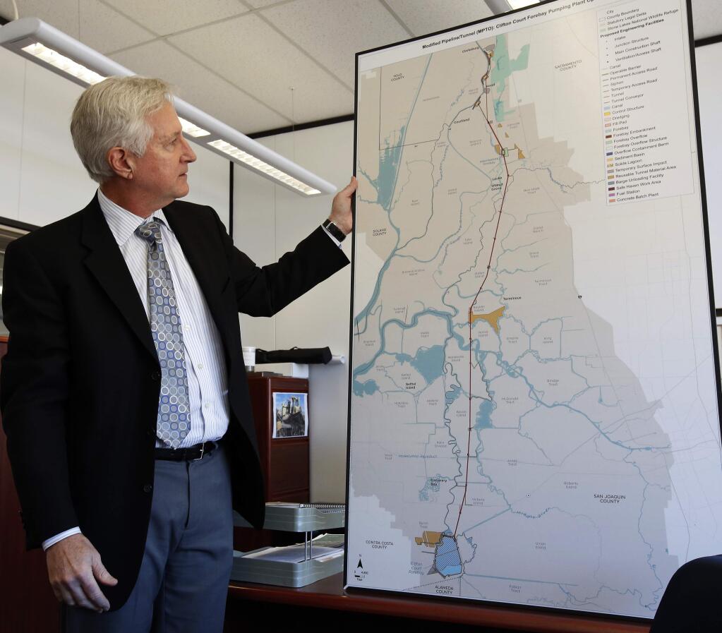 FILE - In this Monday, Feb. 22, 2016 file photo, Mark Cowin, director of the state Department of Water Resources, discusses a proposal to build two tunnels to ship water through the Sacramento-San Joaquin River Delta to Southern California, during an interview in Sacramento, Calif. California Gov. Jerry Brown is scaling back his troubled proposal for overhauling California's water system, at least for now. State official Karla Nemeth wrote Wednesday, Feb. 7, 2018, that the Brown administration is looking at building a single giant water tunnel now. (AP Photo/Rich Pedroncelli, File)