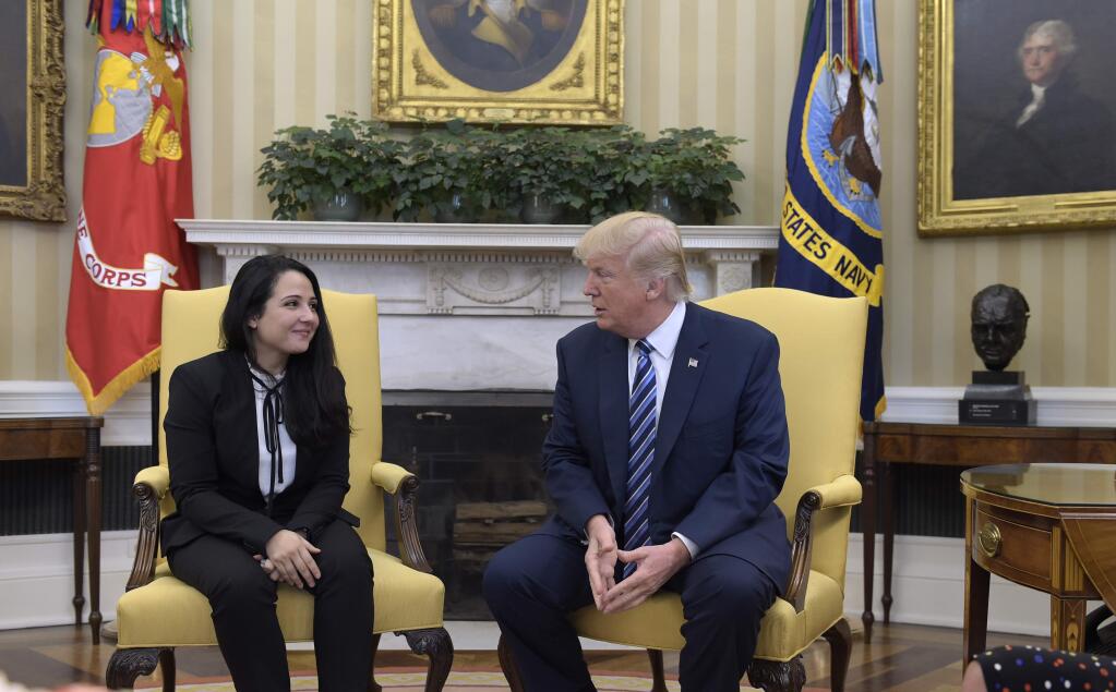 President Donald Trump meets with Aya Hijazi, an Egyptian-American aid worker, in the Oval office of the White House in Washington, Friday, April 21, 2017. Hijazi, an Egyptian-American charity worker was freed after nearly three years of detention in Egypt returning to the U.S., Thursday, April 20, 2017. (AP Photo/Susan Walsh)