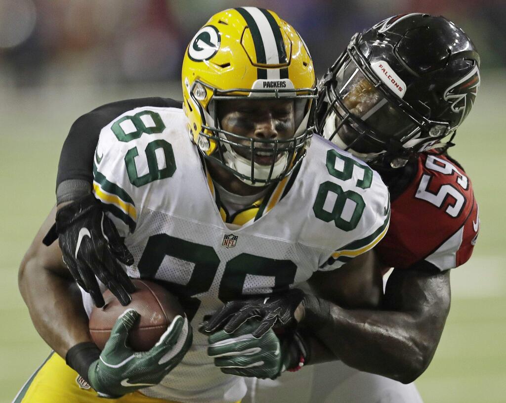 Green Bay Packers' Jared Cook catches a pass in front of Atlanta Falcons' De'Vondre Campbell during the second half of the NFC championship game Sunday, Jan. 22, 2017, in Atlanta. (AP Photo/David J. Phillip)