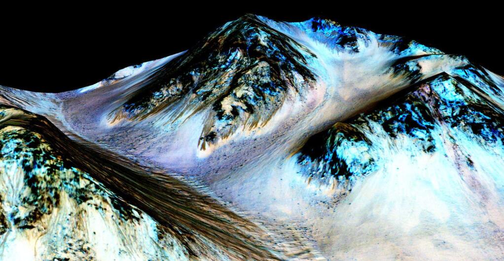This undated photo taken by an instrument aboard NASA's Mars Reconnaissance Orbiter shows dark, narrow streaks on the surface of Mars that scientists believe were caused by flowing streams of salty water. (NASA)