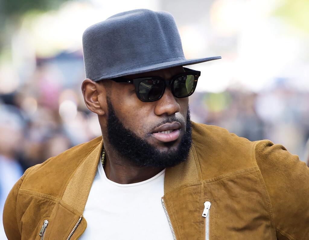 Cleveland Cavaliers forward LeBron James arrives on the red carpet for the new documentary 'The Carter Effect' during the 2017 Toronto International Film Festival in Toronto on Saturday, Sept. 9, 2017. (Nathan Denette/The Canadian Press via AP)