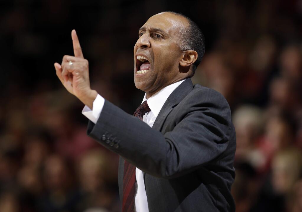 FILE - In this Jan. 14, 2016, file photo, Stanford head coach Johnny Dawkins talks to his players during the first half of an NCAA college basketball game against California in Stanford, Calif. Dawkins has been fired after eight seasons coaching the Stanford men's basketball team. The school announced Dawkins' dismissal Monday, March 14, 2016, saying athletic director Bernard Muir had begun a national search for a new coach. (AP Photo/Marcio Jose Sanchez, File)