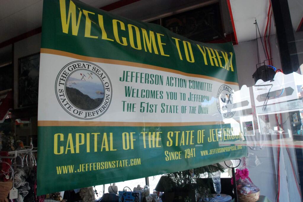 In this Sept. 6, 2013 photo, a banner welcoming visitors to the State of Jefferson hangs in the window of a downtown business in Yreka, Calif. (AP Photo/Jeff Barnard)