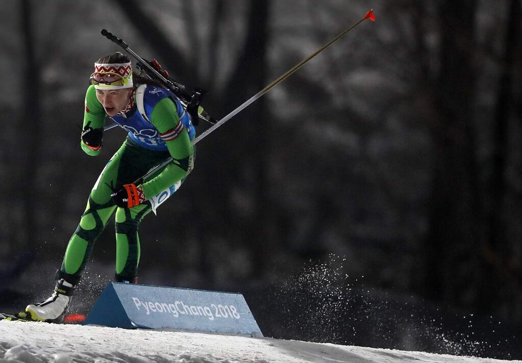 Darya Domracheva, of Belarus skis during her team's gold medal during the women's 4x6-kilometer relay biathlon at the 2018 Winter Olympics in Pyeongchang, South Korea, Thursday, Feb. 22, 2018. (AP Photo/Andy Wong)