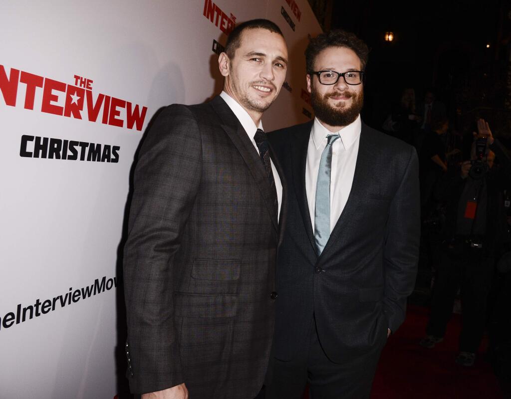 In this Dec. 11, 2014 file photo, actors Seth Rogen, right, and James Franco attend the premiere of the Sony Pictures' film 'The Interview' in Los Angeles. (Photo by Dan Steinberg/Invision/AP Images, File)