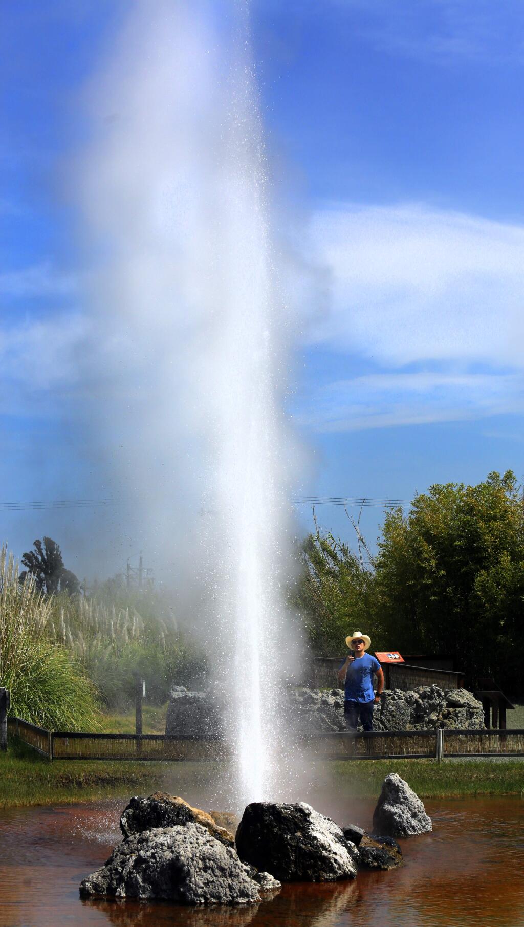 -Rene Paz of Ventura makes a video of the Old Faithful Geyser of California in Calistoga. The geyser is now erupting about every 10 minutes.