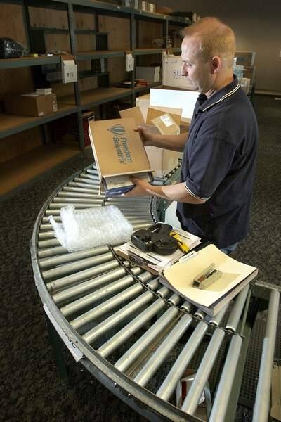 Bob Oliver, who manages shipping and receiving for GC Micro, puts together orders at the Petaluma office in 2007. (Scott Manchester / The Press Democrat)