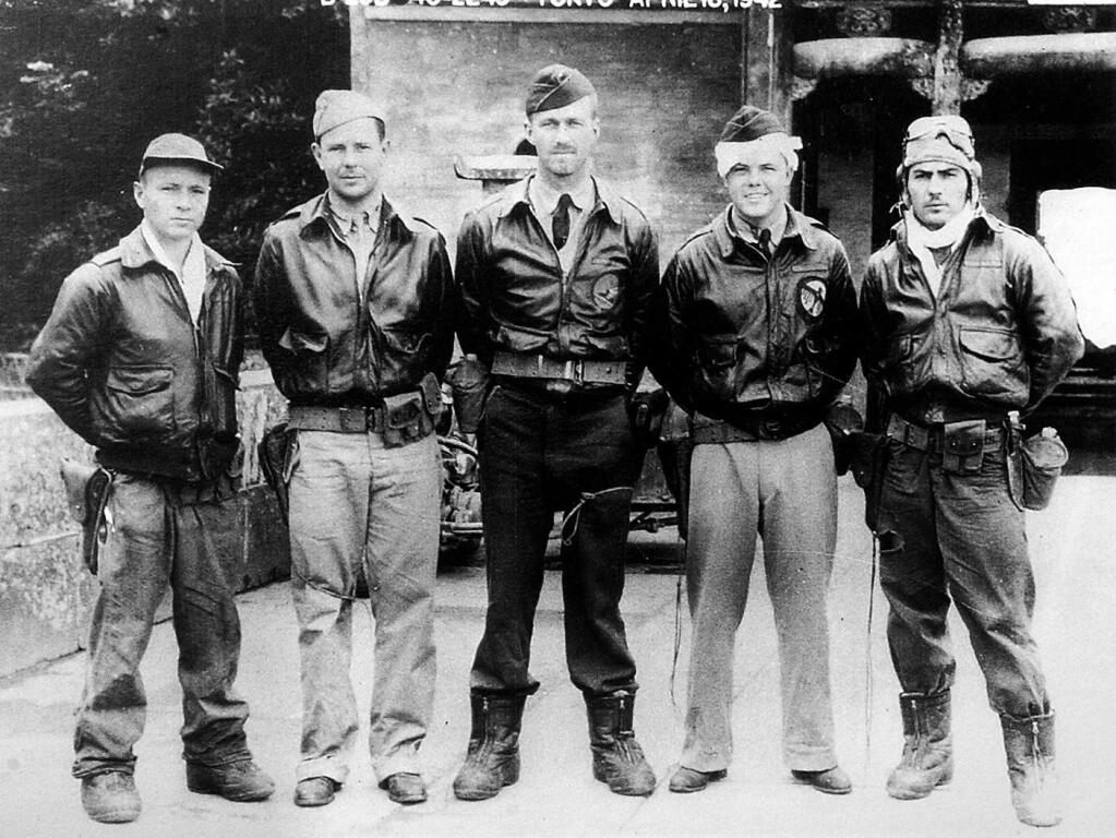 Forty-eight hours after the crew of bomber #11 bailed out, they pose for a picture after being reunited in a small chinese town before being moved to Chuhsien. From left are, Sgt. William Birch, bombadier; Lt. Frank Kappeler, navigator; Capt. C. Ross Greening, pilot; Lt. Ken Reddy, co-pilot; and Sgt. Melvin Gardner, engineer/gunner.