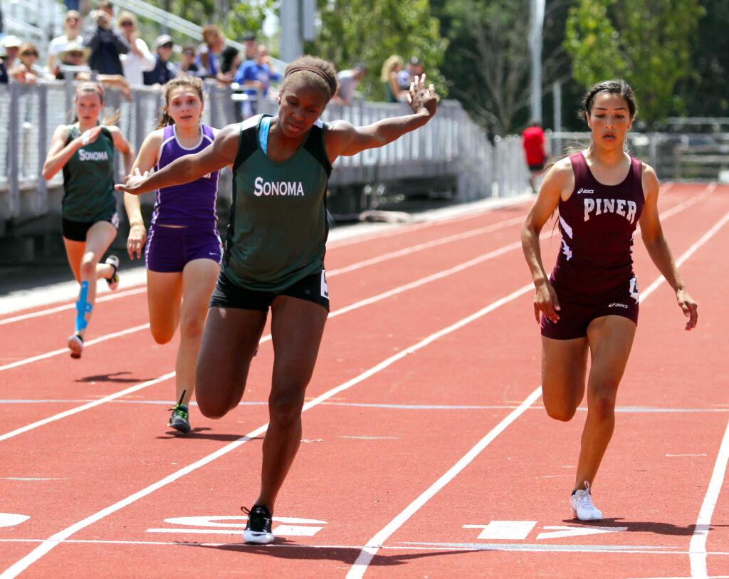 Bill Hoban/Index-TribuneSophomore Kiara Miles captures the 200-meter sprint event on her way to winning three event titles for the Sonoma varsity track girls during last Saturday's SCL championships at Elsie Allen in Santa Rosa.