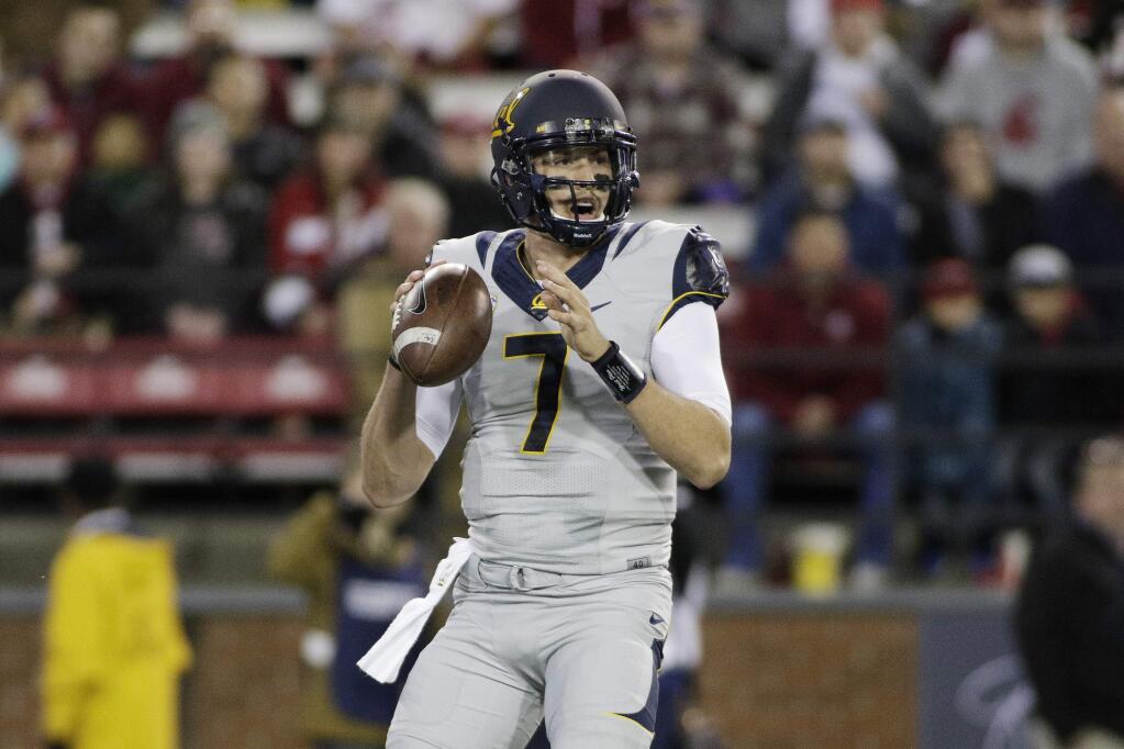 Cal quarterback Davis Webb looks to pass during the first half against Washington State in Pullman, Wash., Saturday, Nov. 12, 2016. (AP Photo/Young Kwak)