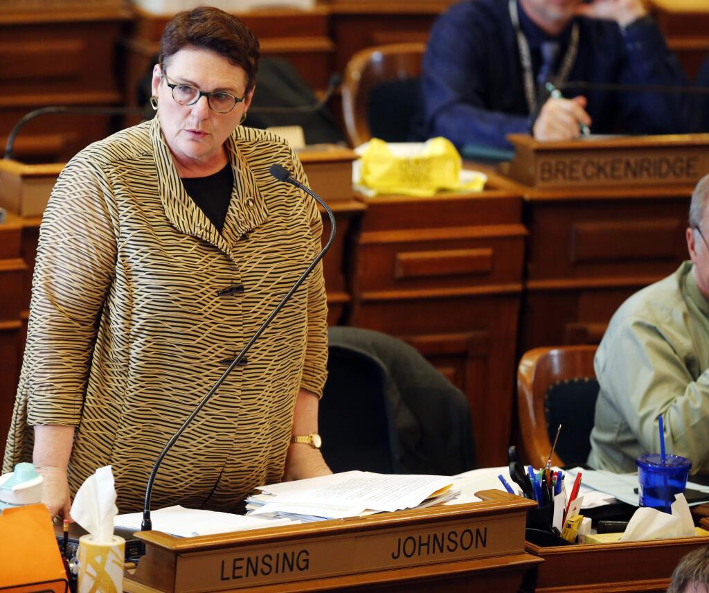 In this Tuesday, May 1, 2018 photo, Rep. Vicki S. Lensing (D-Iowa City) speaks on the floor of the Iowa House as legislators debate the an abortion bill at the state capitol in Des Moines, Iowa. Republican lawmakers with control of the Iowa statehouse fast-tracked a bill early Wednesday that would ban most abortions once a fetal heartbeat is detected, usually around six weeks of pregnancy, sending what could be the nation's most restrictive abortion legislation to the governor. (Zach Boyden-Holmes/The Des Moines Register via AP)