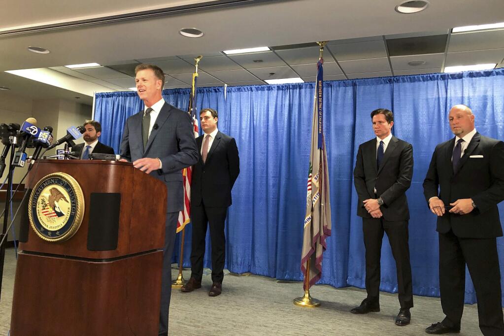 FILE - In this Sept. 30, 2019, file photo, U.S. attorney David Anderson announces criminal spy charges against San Francisco Bay Area tour operator Xuehua Edward Peng, in San Francisco. Federal prosecutors in Northern California say Peng was an illegal foreign agent who delivered classified U.S. natural security information to officials in China. Peng agreed to plead guilty to serving as an unregistered agent for China in exchange for a possible reduced prison sentence, Monday, Nov. 25, 2019. (AP Photo/Janie Har, File)