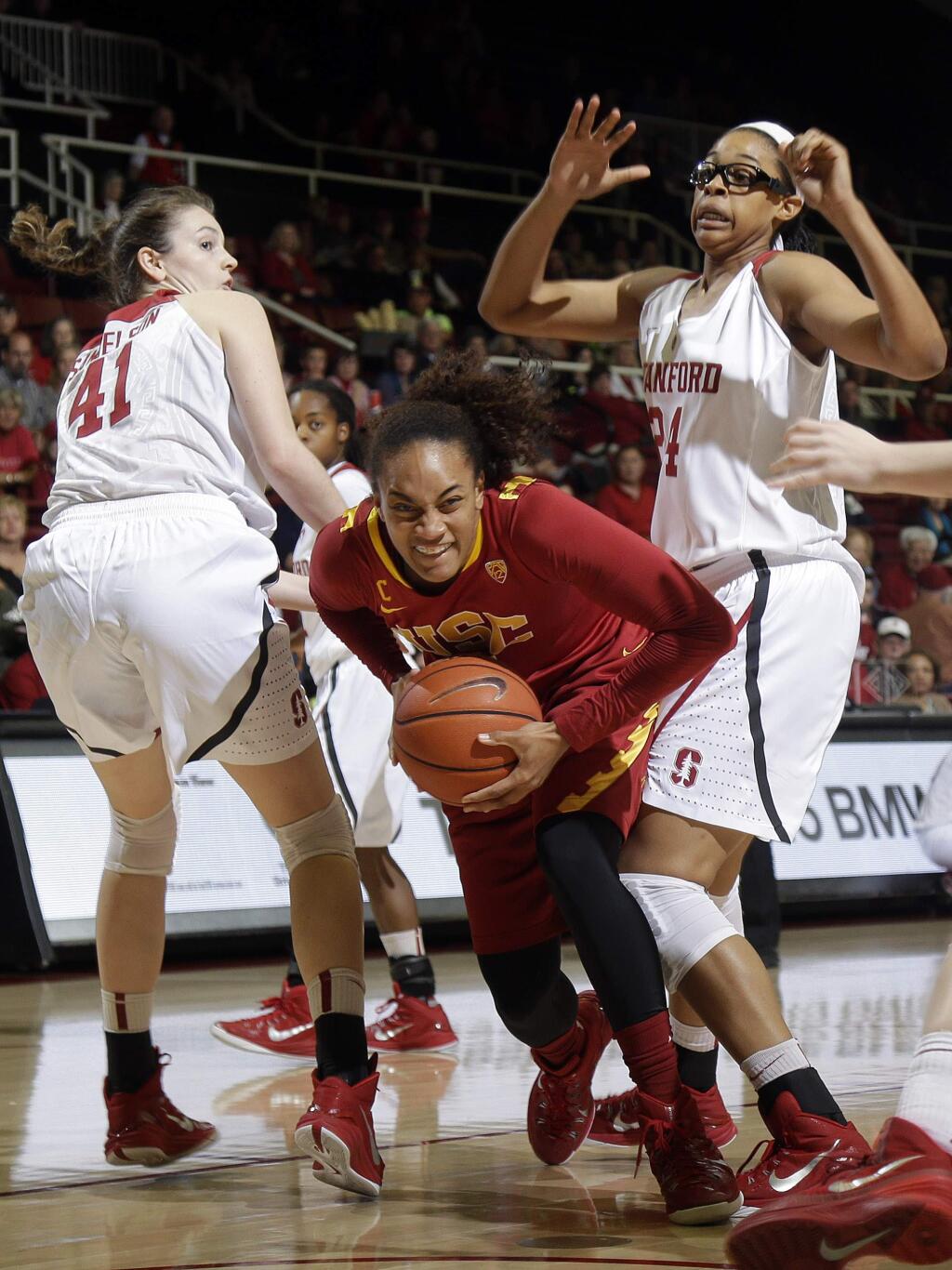 USC forward Alexyz Vaioletama squeezes between Stanford forward Bonnie Samuelson (41) and forward Erica McCall during the first half of a game Friday, Feb. 13, 2015, in Stanford. (AP Photo/Marcio Jose Sanchez)