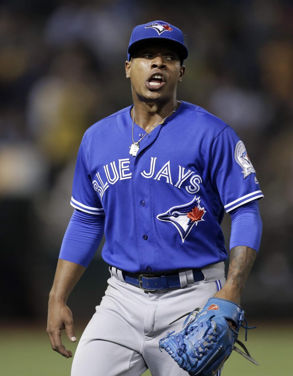 Toronto Blue Jays pitcher Marcus Stroman walks off the field after being removed from the baseball game against the Oakland Athletics during the fifth inning Friday, July 15, 2016, in Oakland, Calif. (AP Photo/Ben Margot)