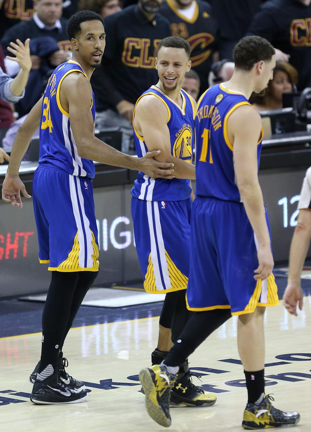 Golden State Warriors' Stephen Curry argues with a referee as he's walked off the court by teammates Shaun Livingston and Klay Thompson, after fouling out, during their game in Cleveland on Thursday, June 16, 2016. The Warriors lost to the Cavaliers 115-101. (Christopher Chung / The Press Democrat)