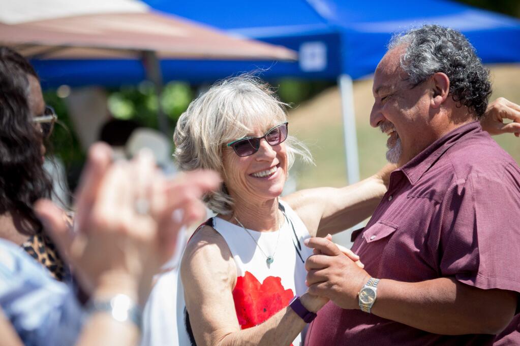 Vivian Brockway and Art Ramirez laugh together while taking dance lessons during Deerfield Ranch Winery's Independence Day Chili Cook-Off Celebration in Kenwood, Calif. Saturday, July 1, 2017. Proceeds from the event benefit the restoration of the Kenwood Wetlands, a wildlife habitat, and home of the Kenwood Marsh Checkerbloom. (Jeremy Portje / For The Press Democrat)