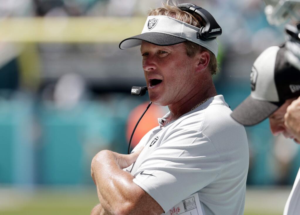 In this Sunday, Sept. 23, 2018, file photo, Oakland Raiders head coach Jon Gruden works the sideline during the first half against the Miami Dolphins in Miami Gardens, Fla. (AP Photo/Lynne Sladky, File)