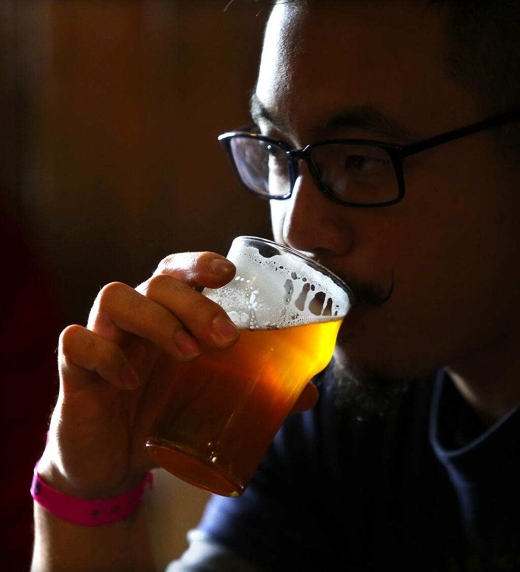 Beer lovers from around the world stood in line for their chance to taste Pliny the Younger at Russian River Brewing Company in Santa Rosa on Friday. (JOHN BURGESS / The Press Democrat)