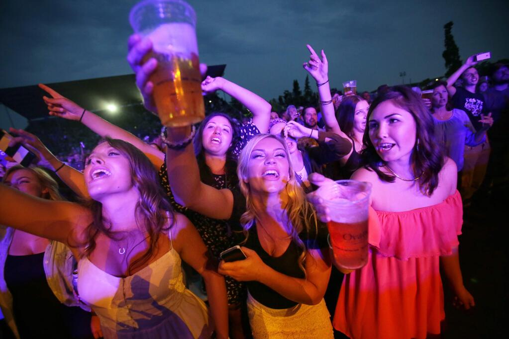 Fans of Billy Currington sing along to his song, 'Pretty Good at Drinkin' Beer' during his concert at Tuesday's Sonoma County Fair in Santa Rosa, August 5, 2014. (Conner Jay/The Press Democrat)