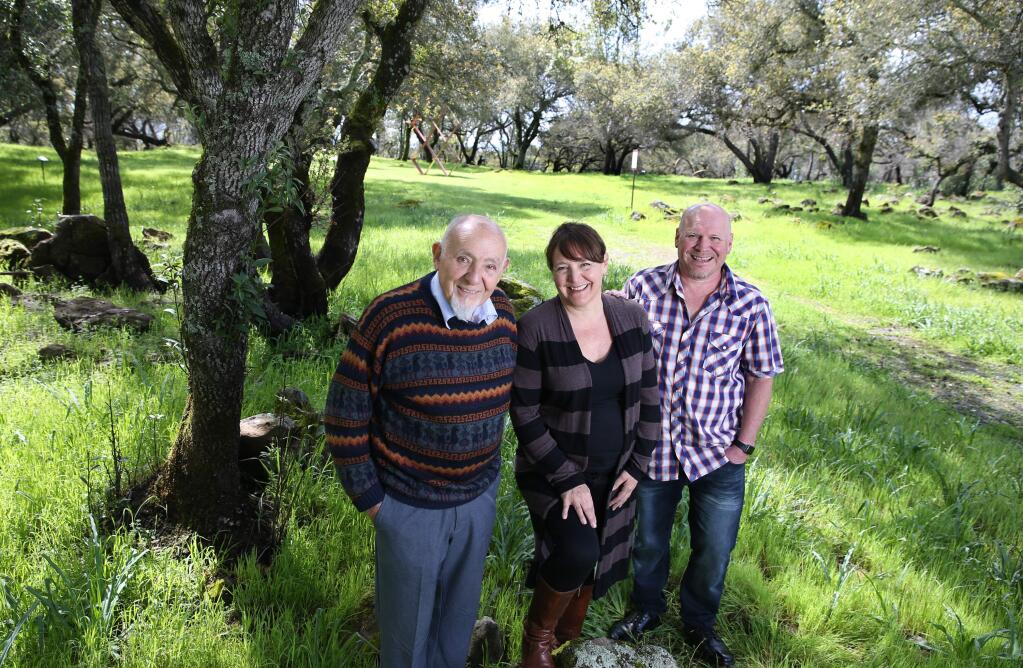 Founder Walter Byck, left, his daughter Sonia Byck-Barwick, and his son Rene Byck stand in Marijke's Grove at Paradise Ridge Winery in Santa Rosa, California on Tuesday, March 26, 2019. (BETH SCHLANKER/The Press Democrat)
