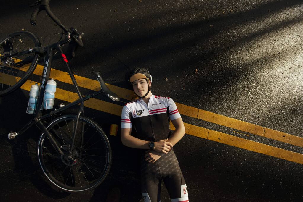 Oliver Cannard, 18, a Sonoma Valley High School graduate recently completed a solo bike ride across the US. During his 4,228 miles trek he was attacked by dogs in Missouri and once had his jacket brushed by a side-view mirror from a speeding car. “I remember sometimes, I just listened to my tires on the pavement. It was soothing,” said Cannard, photographed on Irwin Lane in Santa Rosa, California. December 1, 2018.(Photo: Erik Castro/for The Press Democrat)