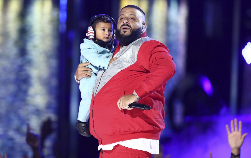 DJ Khaled performs 'I'm The One' while holding his son Asahd at the BET Awards at the Microsoft Theater on Sunday, June 25, 2017, in Los Angeles. (Photo by Matt Sayles/Invision/AP)