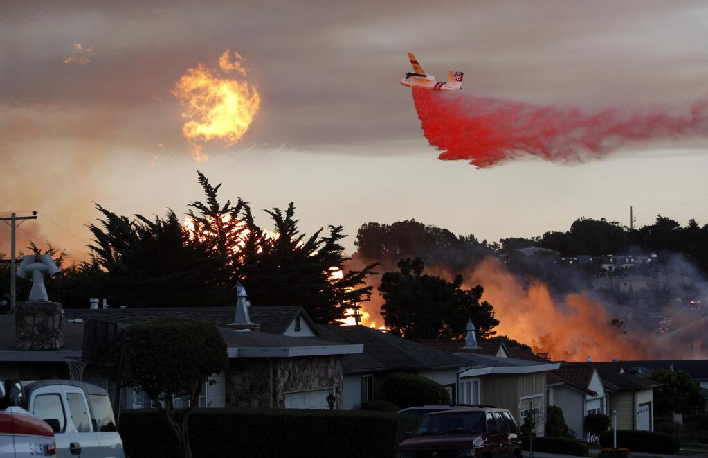 In this Sept. 9, 2010 file photo, a massive fire following a pipeline explosion roars through a mostly residential neighborhood in San Bruno, Calif. (AP Photo/Jeff Chiu, File)