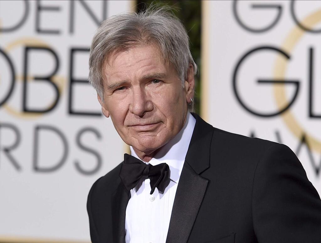 FILE - In this Jan. 10, 2016 file photo, Harrison Ford arrives at the 73rd annual Golden Globe Awards in Beverly Hills, Calif. Newly released video shows a plane piloted by Ford mistakenly flying low over an airliner that was taxiing at a Southern California airport. The 45 seconds of video released Tuesday, Feb. 21, 2017, shows the 74-year-old 'Star Wars' and 'Indiana Jones' star's potentially serious mishap at John Wayne Airport in Orange County. (Photo by Jordan Strauss/Invision/AP, File)