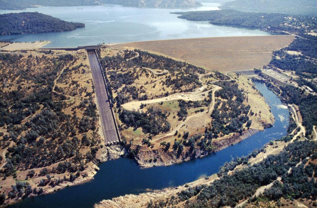 FILE - This June 23, 2005 file photo provided by the California Department of Water Resources shows Oroville Dam, Lake Oroville and the Feather River in the foothills of the Sierra Nevada near Oroville, Calif. (Paul Hames/California Department of Water Resources via AP, File)