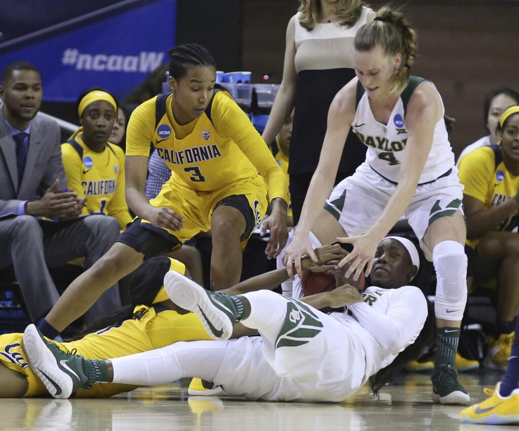Baylor guard Alexis Jones, bottom right, passes the ball to guard Kristy Wallace (4) after battling California forward Mikayla Cowling (3) and guard Mi'Cole Cayton, lower left, during the second half of a second-round game in the NCAA women's college basketball tournament in Waco, Texas, Monday, March 20, 2017. Baylor won 86-46. (AP Photo/Rod Aydelotte)