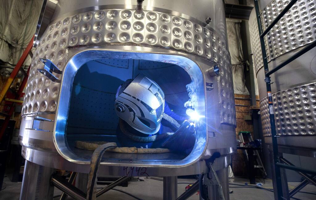 Israel Alvarez welds the inside of a tank destined for a brew house at the Criveller Groups California facility in Healdsburg. The company began 50 years ago with wine tanks and now make tanks for olive oil producers, brewhouses and spirit makers. (photo by John Burgess/The Press Democrat)