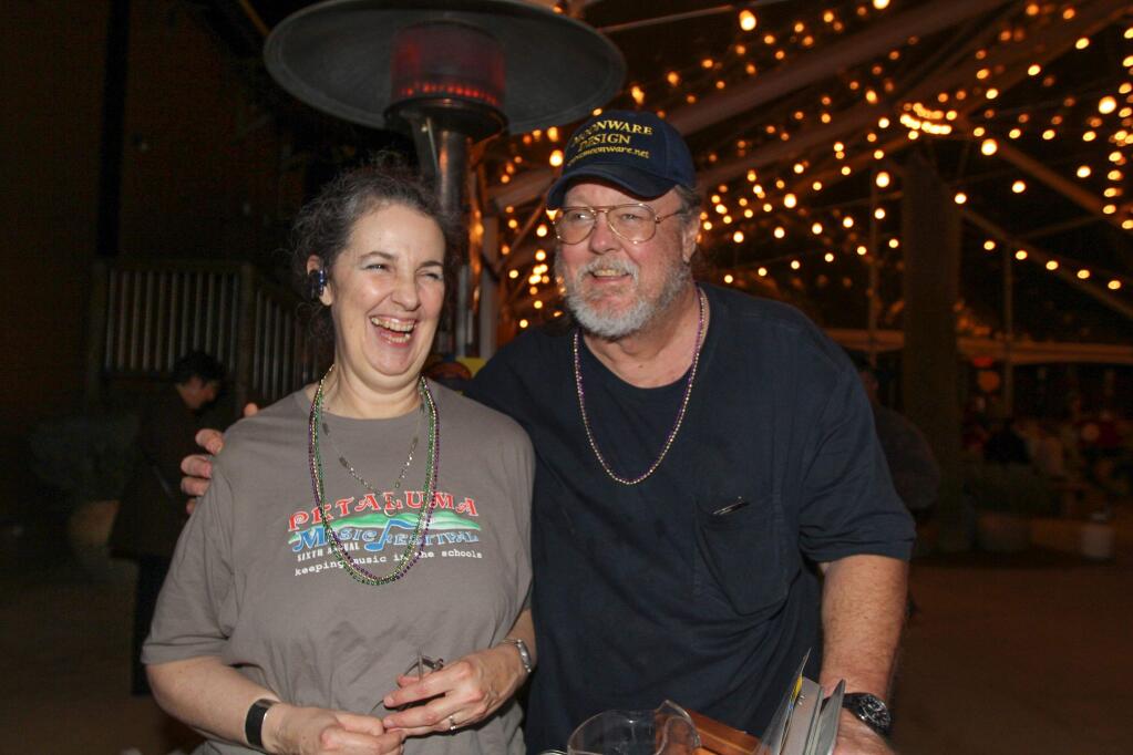 Meg and her husband and PMF President Mark Mooney at the Petaluma Music Festival's Mardi Gras fundraiser at Lagunitas in 2014. Mark Mooney is the 2017 Service to Youth award winner. VICTORIA WEBB FOR THE ARGUS-COURIER