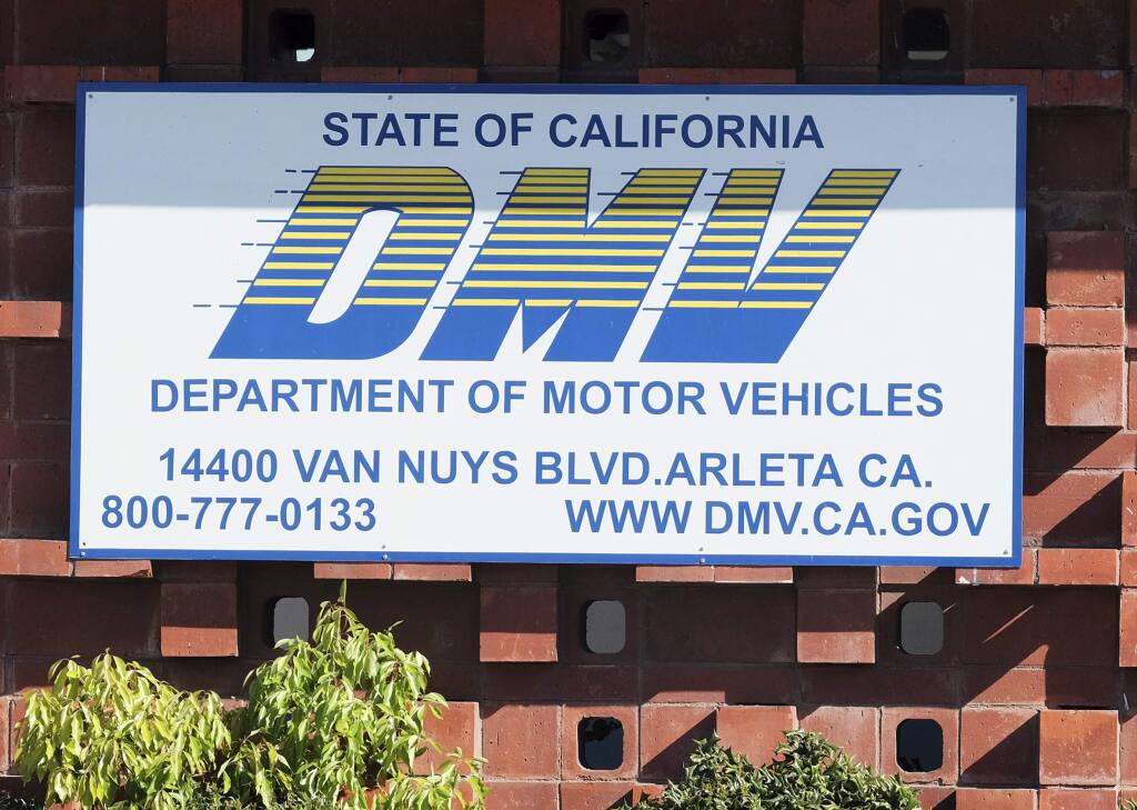 FILE - In this April 9, 2019 file photo is the California Department of Motor Vehicles office in the Arleta neighborhood of Los Angeles. (AP Photo/Richard Vogel, File)