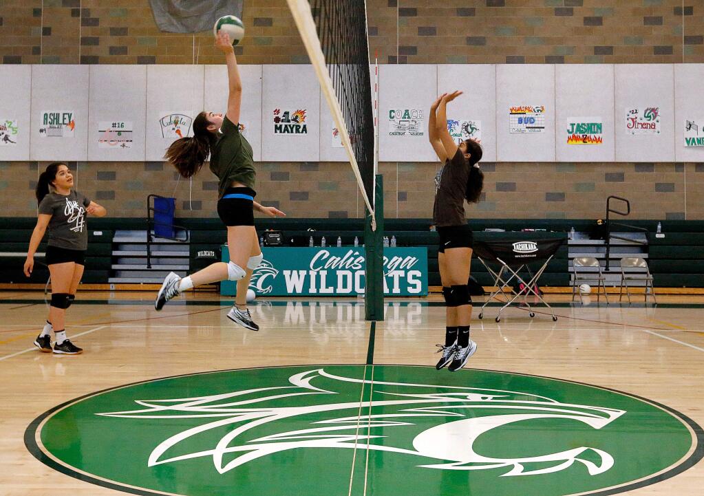 Calistoga's Andrea Villaseñor, second from left, goes up for a hit while teammate Jimena Guerrero, right, defends as the Wildcats scrimmage during varsity volleyball practice at Calistoga High School on Tuesday, Oct. 30, 2018. (Alvin Jornada / The Press Democrat)