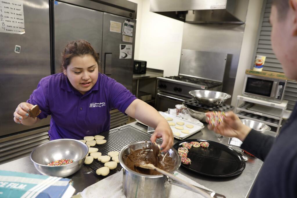 Heidy Ortiz, 18, makes cookies in the culinary arts class at Amarosa Academy on Wednesday, May 2, 2018 in Santa Rosa, California . (BETH SCHLANKER/The Press Democrat)