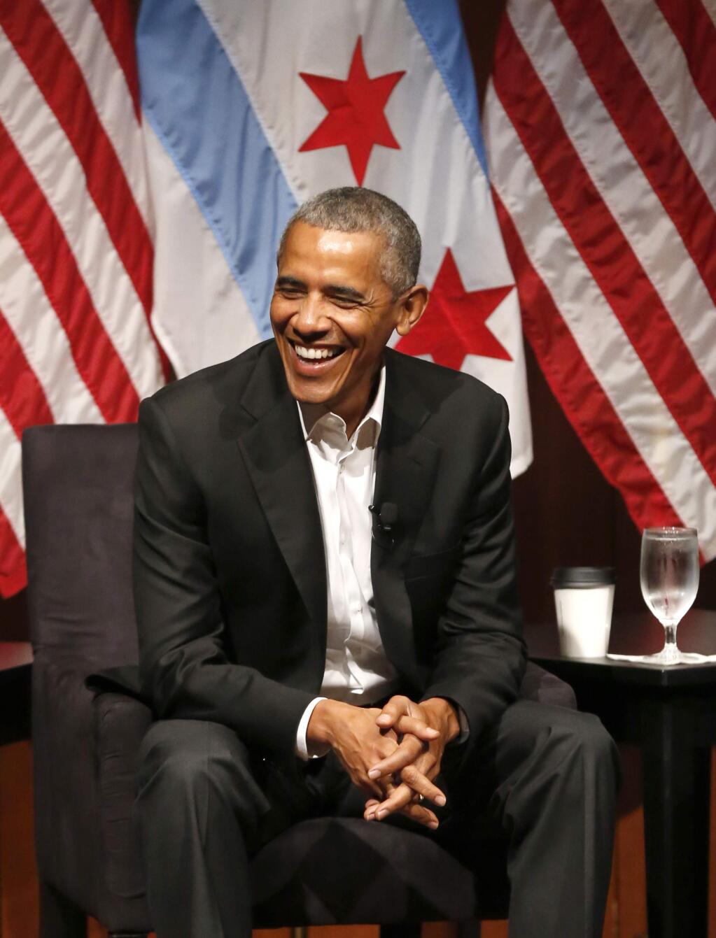 Former President Barack Obama smiles as he hosts a conversation on civic engagement and community organizing, Monday, April 24, 2017, at the University of Chicago in Chicago. It's the former president's first public event of his post-presidential life in the place where he started his political career. (AP Photo/Charles Rex Arbogast)