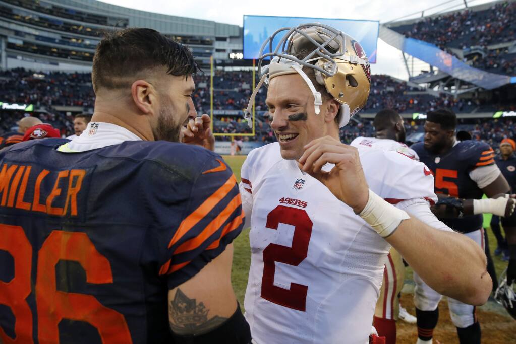 San Francisco 49ers quarterback Blaine Gabbert (2) talks to Chicago Bears tight end Zach Miller (86) after an NFL football game, Sunday, Dec. 6, 2015, in Chicago. The 49ers won 26-20. (AP Photo/Charles Rex Arbogast)