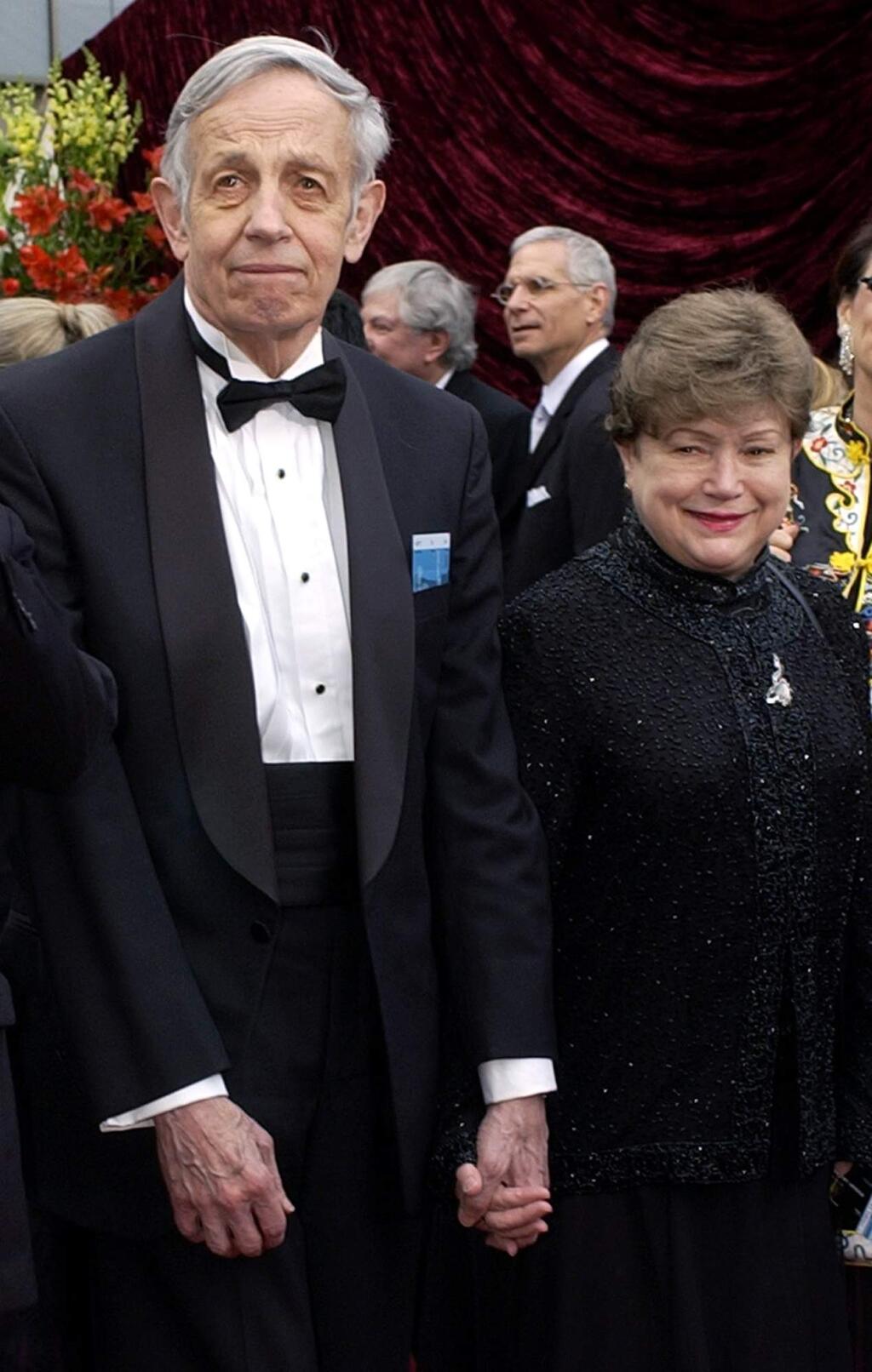 FILE - In this March 24, 2002 file photo, John Nash, left, and his wife Alicia, arrive at the 74th annual Academy Awards, in Los Angeles. Nash, the Nobel Prize-winning mathematician whose struggle with schizophrenia was chronicled in the 2001 movie 'A Beautiful Mind,î died in a car crash along with his wife in New Jersey on Saturday, May 23, 2015, police said. (AP Photo/Laura Rauch, File)
