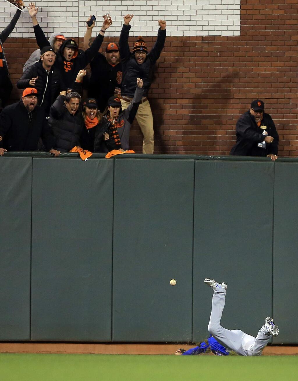 Chicago's Albert Almora Jr. fails to catch a triple by Conor Gillaspie which scored two runs in the eighth inning of Game 3 during the NLDS at AT&T Park in San Francisco, Monday, Oct. 10, 2016. (Kent Porter / The Press Democrat)