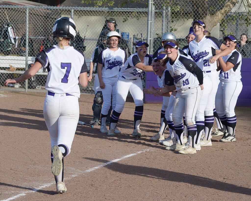 SUMNER FOWLER/FOR THE ARGUS-COURIERPetaluma players excitedly greet Kaleigh Weiand after her home run in the eighth inning provided a 5-4 win over rival Casa Grande.
