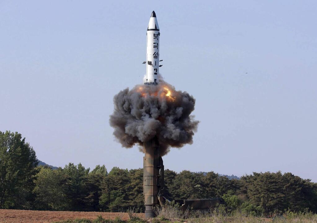 FILE - In this undated file photo distributed by the North Korean government on May 22, 2017, a solid-fuel 'Pukguksong-2' missile lifts off during its launch test at an undisclosed location in North Korea. North Korea said Wednesday that it was examining operational plans for attacking Guam, an angry reaction to U.N. punishment for recent North Korean intercontinental ballistic missile tests and a U.S. suggestion about preparations for possible preventive attacks to stop the North's nuclear weapons program. (Korean Central News Agency/Korea News Service via AP, File)