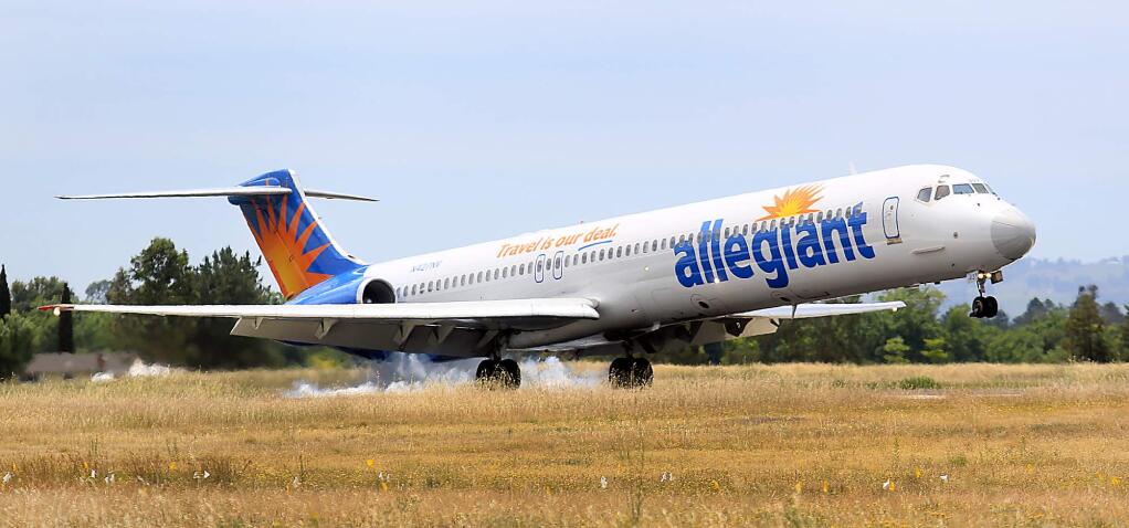 An Allegiant Air flight from Las Vegas touches down for the first time at the Charles M. Schulz-Sonoma County Airport in Santa Rosa on Thursday, May 19, 2016. (KENT PORTER/ PD FILE)