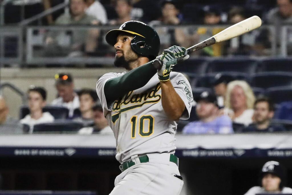 In this Aug. 30, 2019, file photo, the Oakland Athletics' Marcus Semien watches his home run during the ninth inning against the New York Yankees in New York. (AP Photo/Frank Franklin, File)