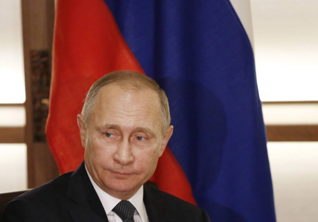 Russian President Vladimir Putin is seen in Nagato, western Japan, Thursday, Dec. 15, 2016. The Obama administration suggested Thursday that Putin personally authorized the hacking of Democratic officials' email accounts in the run-up to the presidential election, which intelligence agencies believe was designed to help Donald Trump prevail. The White House also leveled an astounding attack on Trump himself, saying he must have known of Russia's interference. (Toru Hanai/Pool Photo via AP)
