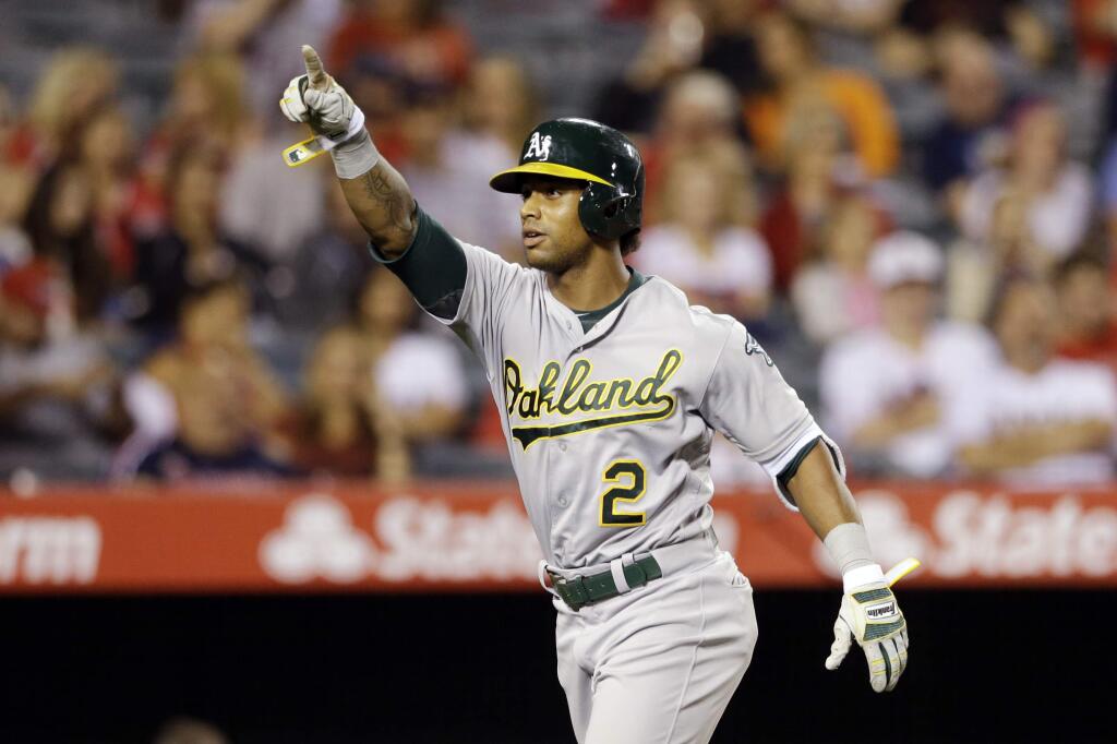 Oakland Athletics' Khris Davis reacts after hitting a home run during the fifth inning against the Los Angeles Angels, Thursday, June 23, 2016, in Anaheim. (AP Photo/Gregory Bull)