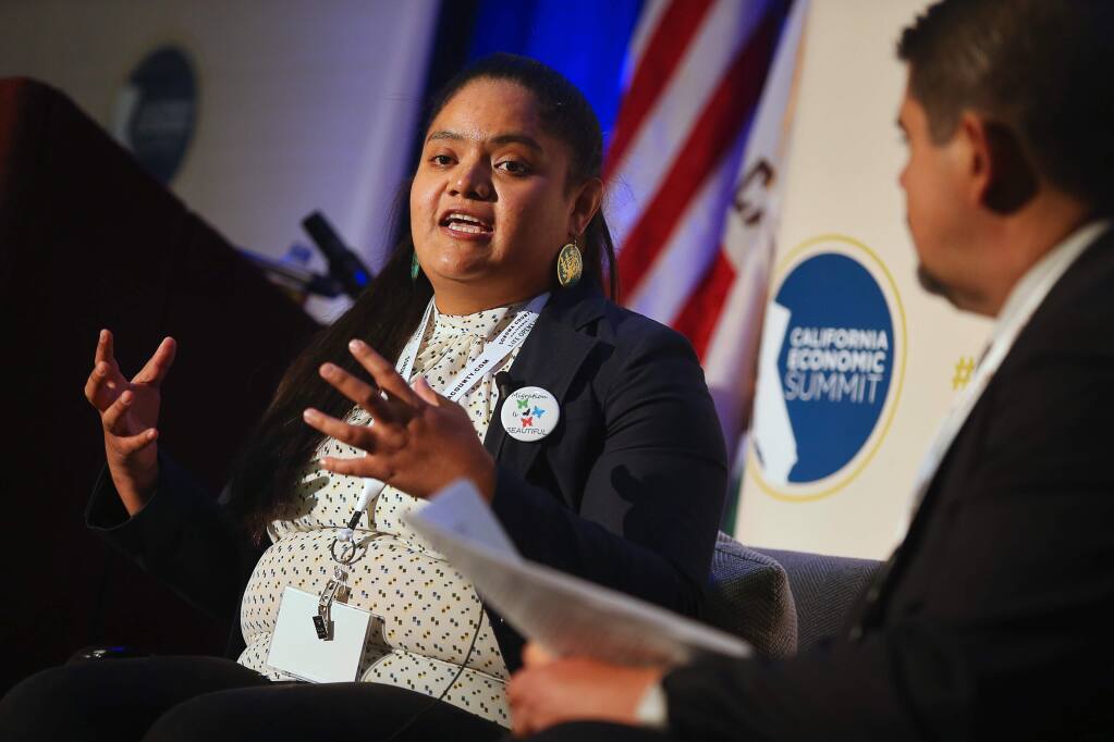 Ana Lugo answers a question posed by Oscar Chavez during the California Economa Summit, in Santa Rosa on Thursday, November 15, 2018. (Christopher Chung/ The Press Democrat)