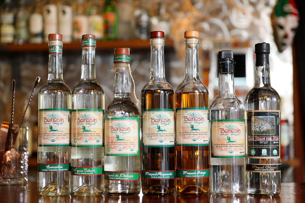 Bottles of Benesin Mezcal, and San Juan del Rio Mezcal, produced by master distiller Efrain Nolasco.(Christopher Chung/ The Press Democrat)